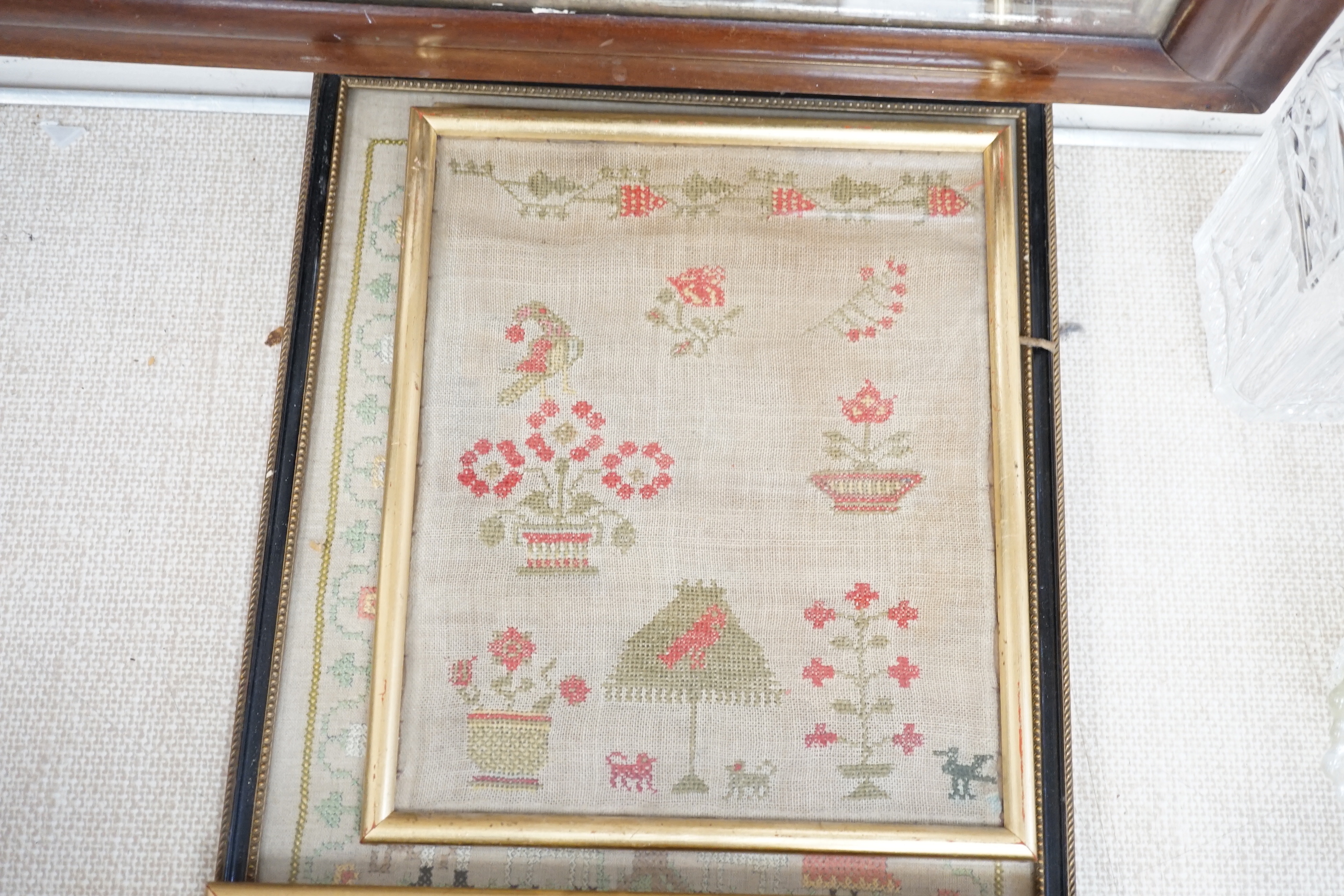 Five various Victorian needlework samplers, and another, 1927, largest 41cm wide x 46cm high